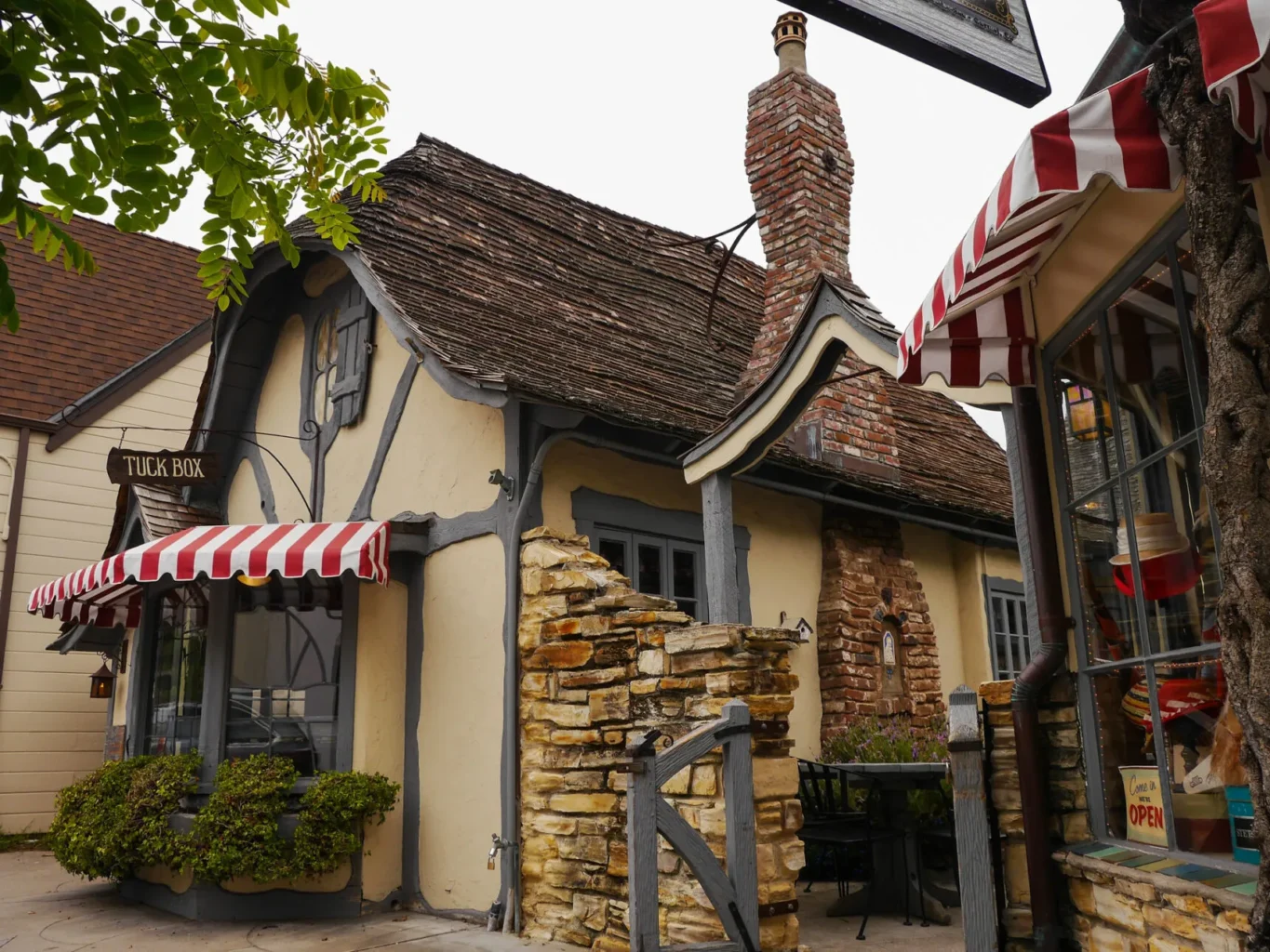 Storybook cottage in Carmel with thatched roof and garden